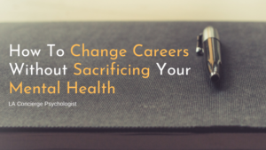 up close photo of dark grey notebook with gold pen on the right side of the notebook