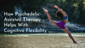 flexible person jumping over a river with head back and leg pointed back towards head